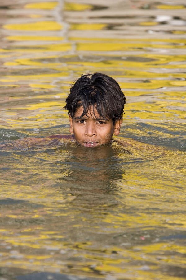 Boy Swimming In River
