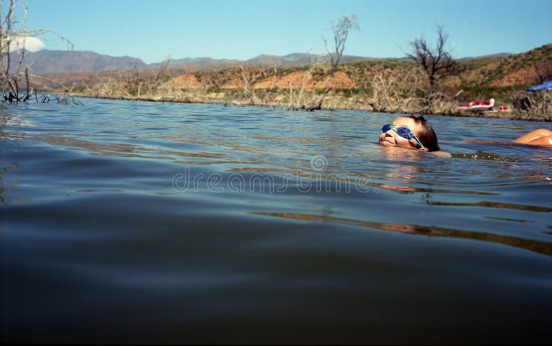 Boy Swimming in Lake stock photo. Image of people, resort 10457400