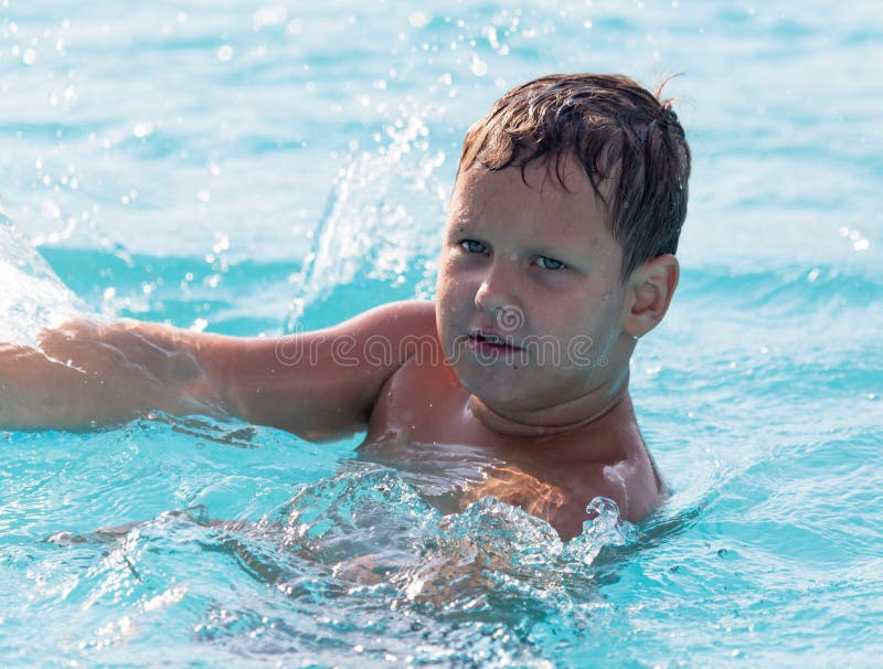 The Boy is Swimming in the Pool Stock Image Image of aqua, cheerful