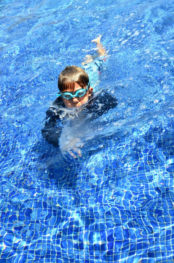Boy and Girl Swimming in the Pool Stock Photo Image of child, colors