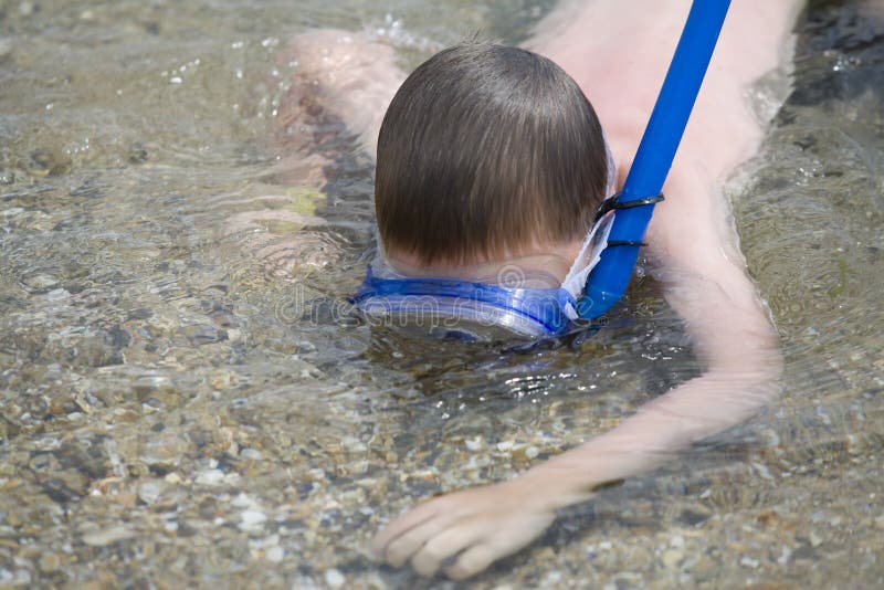 Boy Swims in Sea a Mask for Scuba Diving. Stock Photo Image of happy