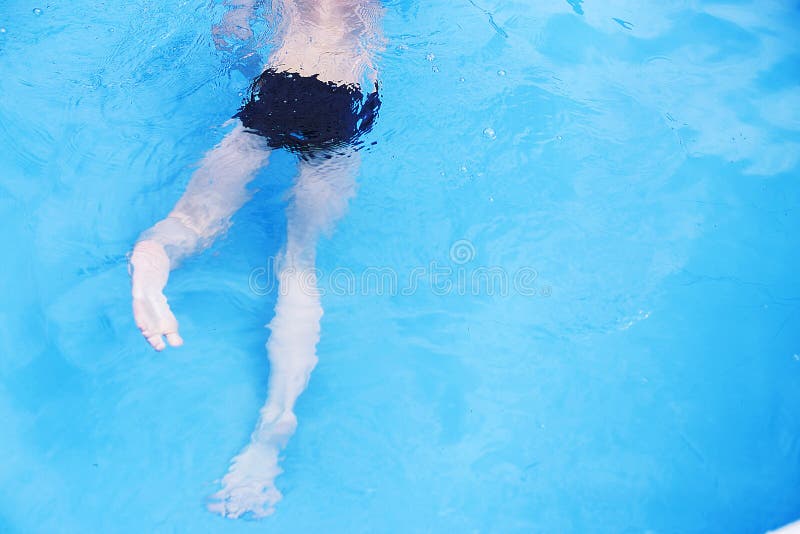 Boy Swims in the Pool. Boy Learning To Swim Stock Photo Image of