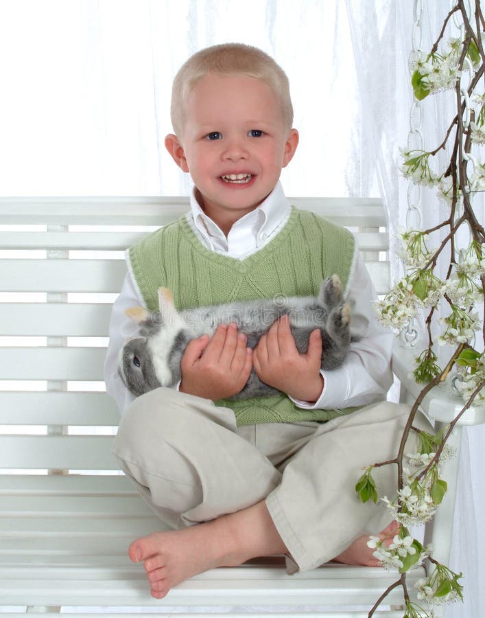 Boy on Swing Holding Bunny