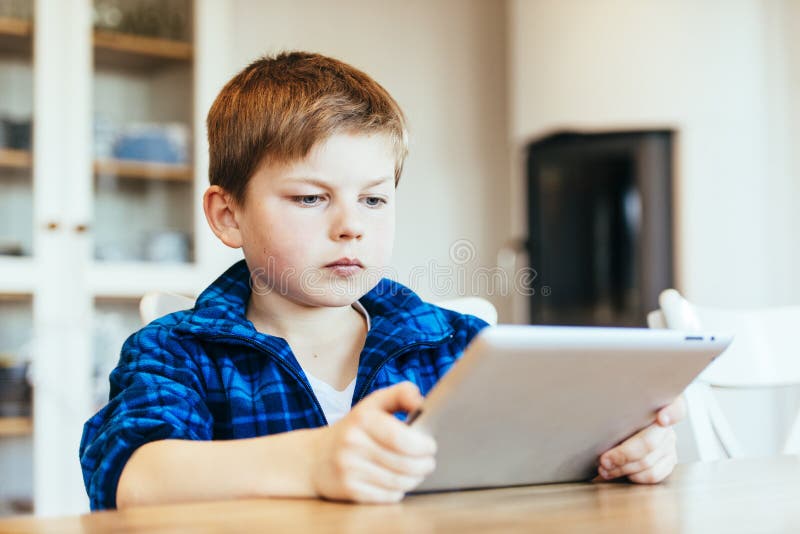 Boy on ipad stock image. Image of playing, read, learn - 34860131