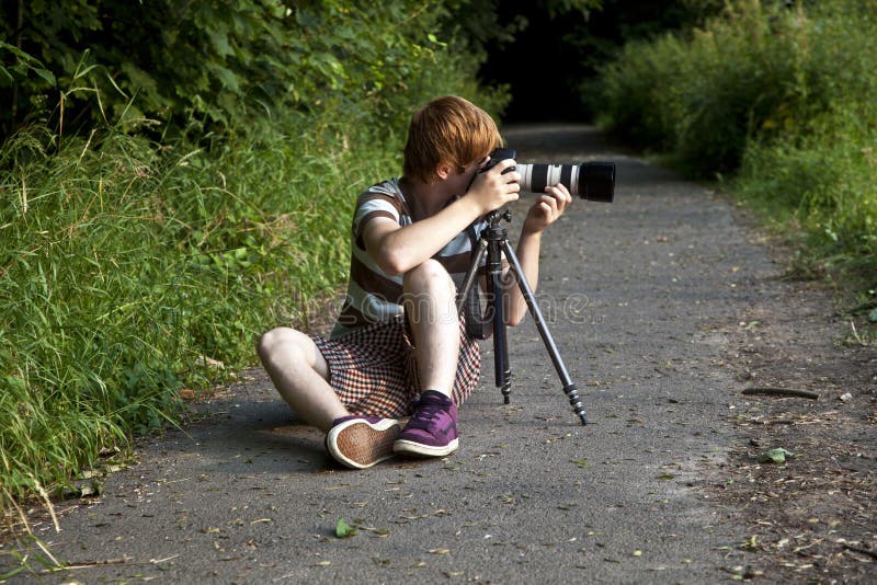 Boy taking pictures with tripod