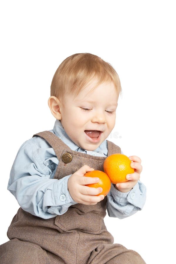 Boy with tangerines