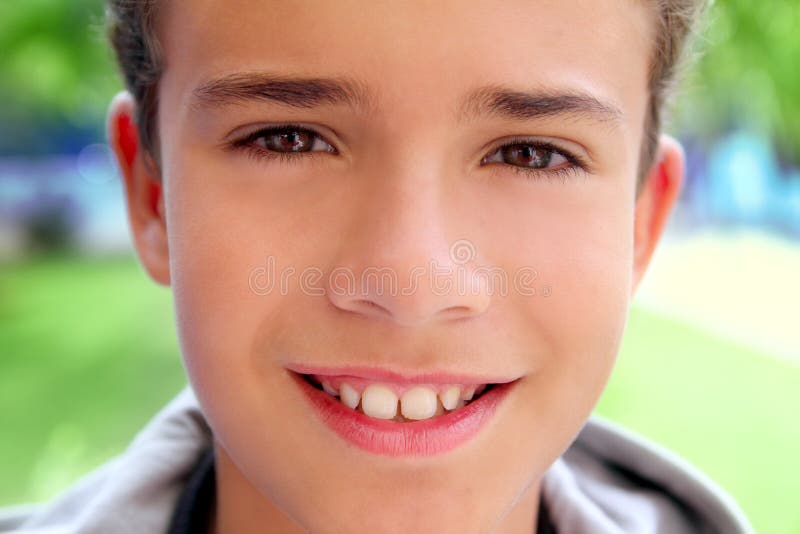 Boy teenager closeup face macro happy smiling outdoor green garden