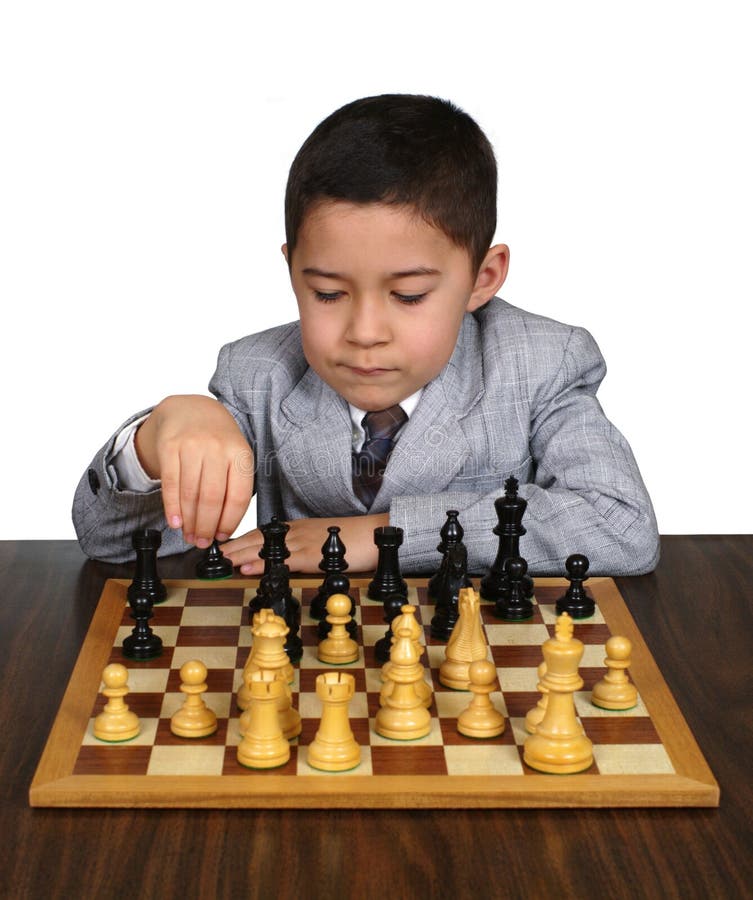 Pupil kid thinking about his next move in a game of chess. Concentrated  little boy sitting at the table and playing chess Stock Photo - Alamy
