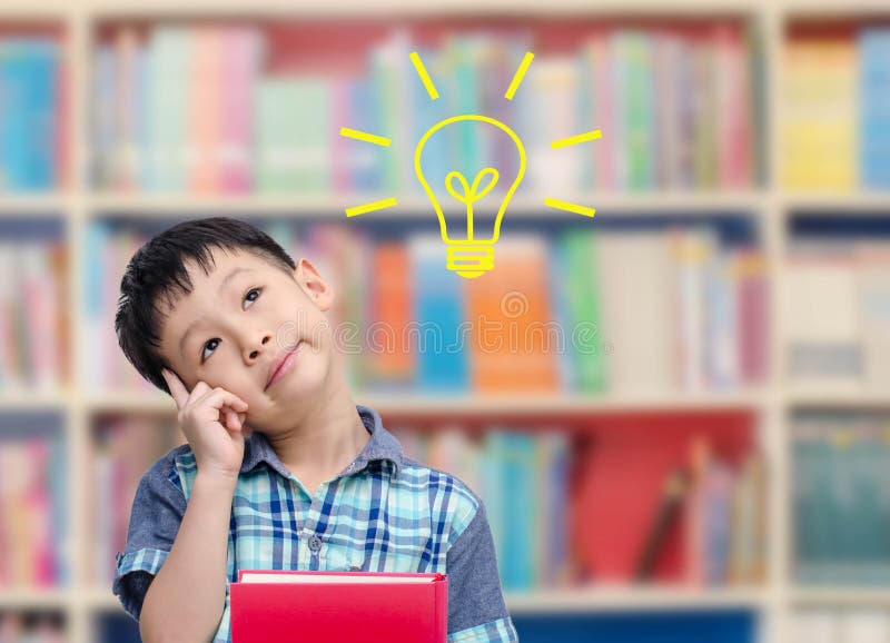 Boy thinking in library