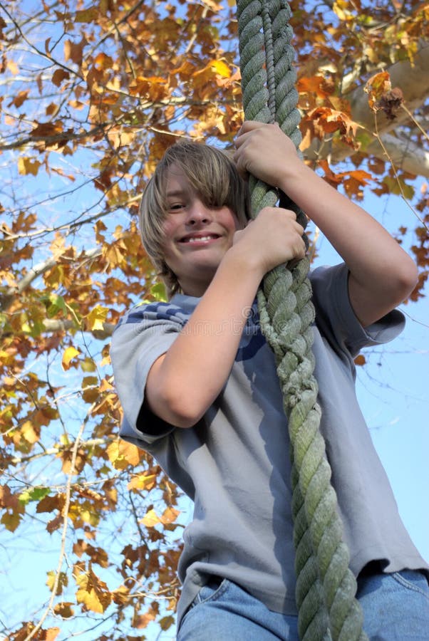 Boy on tire swing