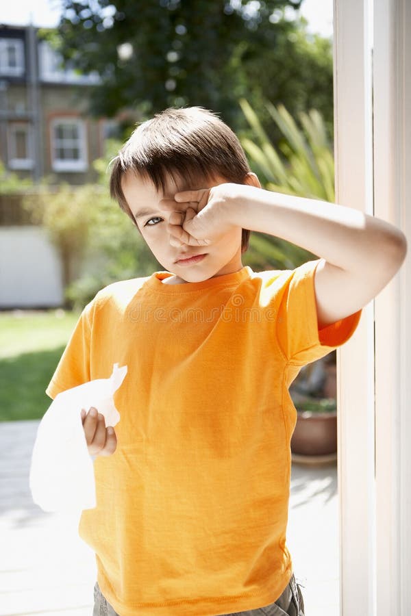 Boy with Tissue Paper Rubbing Eye Stock Photo Image of male, person