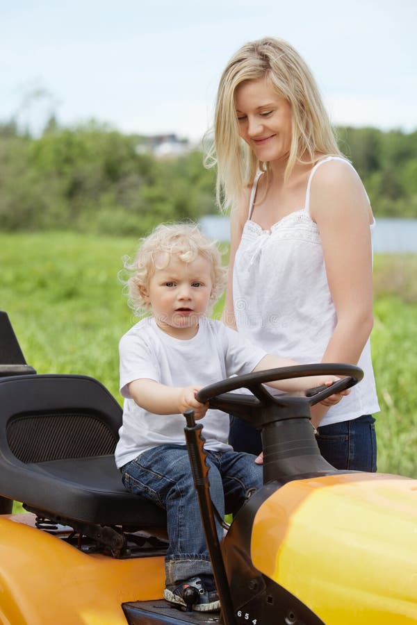 Boy Toddler Sitting on Lawn Tractor Stock Photo Image of playing, baby 21082660