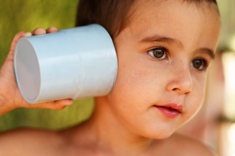 Boy with a toy communication device