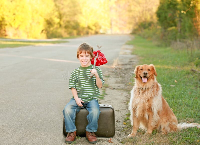 Boy Traveling with Dog stock image Boy Traveling with Dog stock image