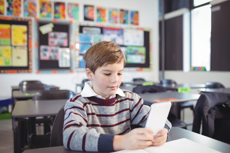 Boy Using Digital Tablet in Classroom Stock Image Image of desk