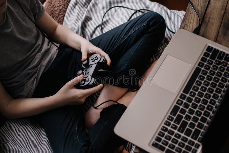 Having Fun at Home. Cheerful Black Teen Guy with Joystick Playing Online  Computer Games, Sitting on Couch Indoors Stock Image - Image of computer,  person: 227478857