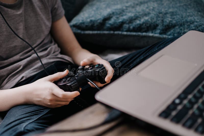 Having Fun at Home. Cheerful Black Teen Guy with Joystick Playing Online  Computer Games, Sitting on Couch Indoors Stock Image - Image of computer,  person: 227478857