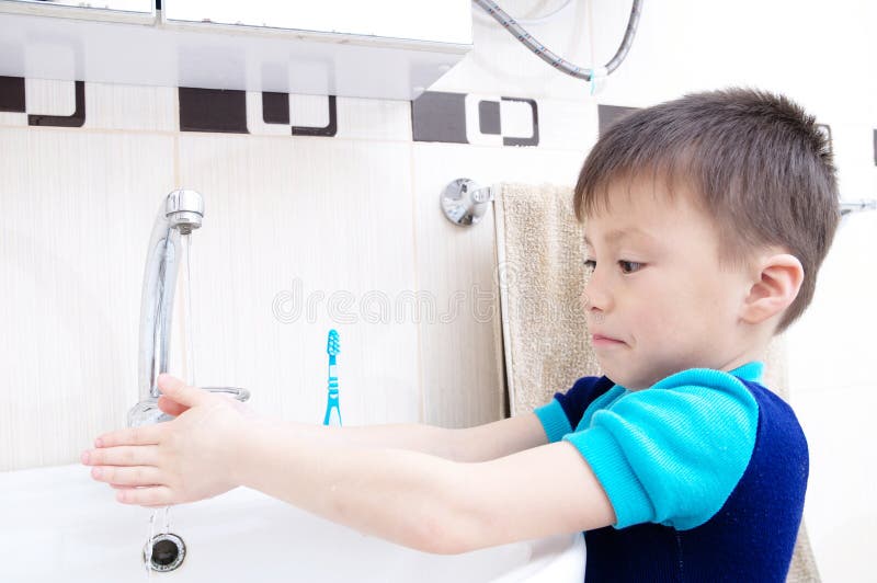 Boy washing hands, child personal health care, hygiene concept, kid washing hand in wash basin in bathroom royalty free stock photo Boy washing hands, child personal health care, hygiene concept, kid washing hand in wash basin in bathroom royalty free stock photo