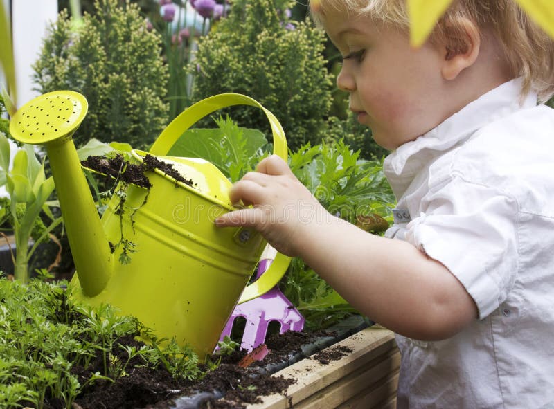 Boy and watering can