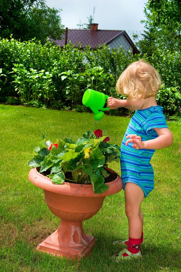 Boy watering the garden