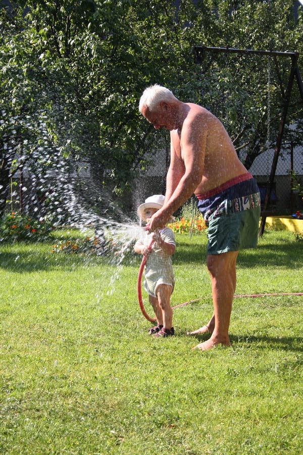 Boy watering the garden