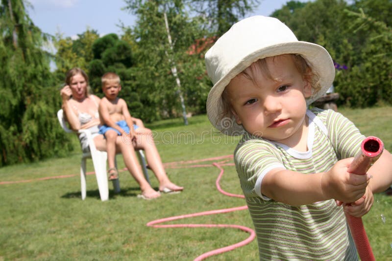 Boy watering the garden