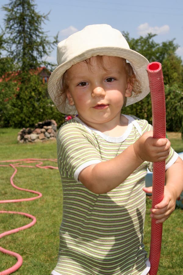 Boy watering the garden