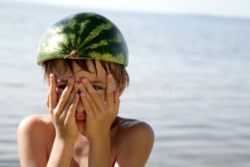 Boy with watermelon hat stock photo. Image of outdoors 4777062
