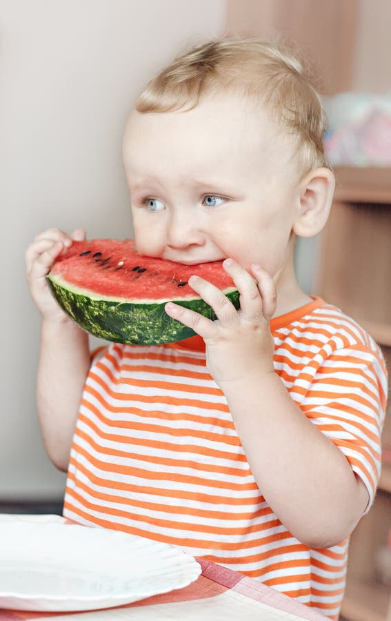Boy with watermelon stock photos