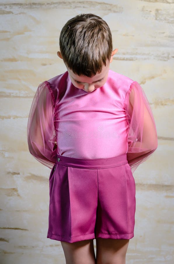 Boy Wearing Pink Dance Outfit with Head Bowed stock image Boy Wearing Pink Dance Outfit with Head Bowed stock image