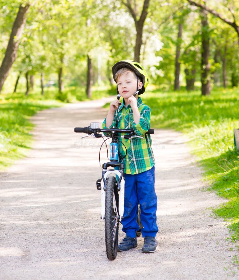 Boy wears a bicycle helmet stock image. Image of active 74403617