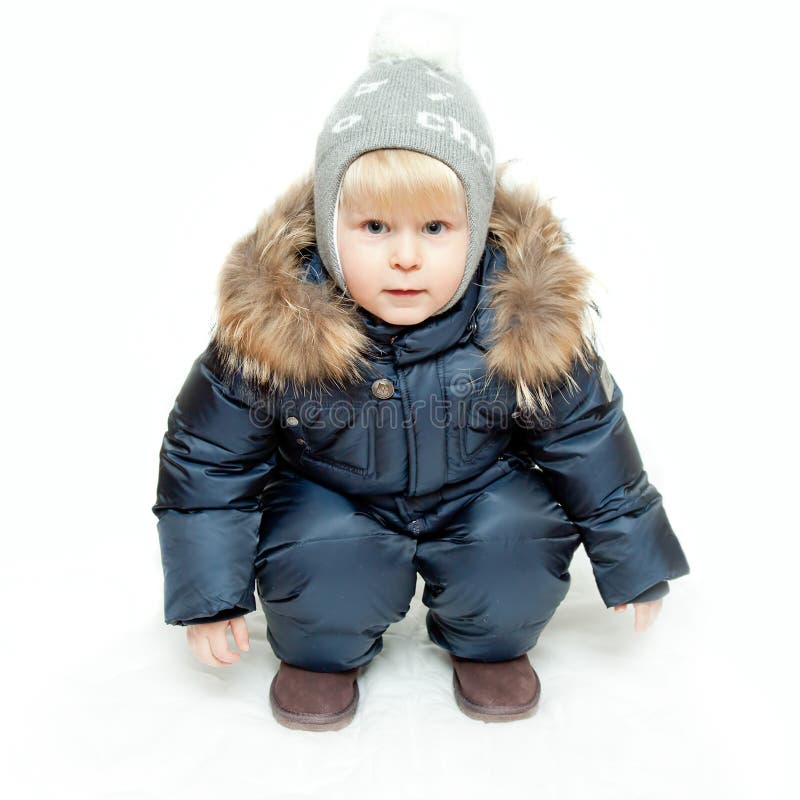 The boy in winter overalls stock image. Image of clothing - 24516691