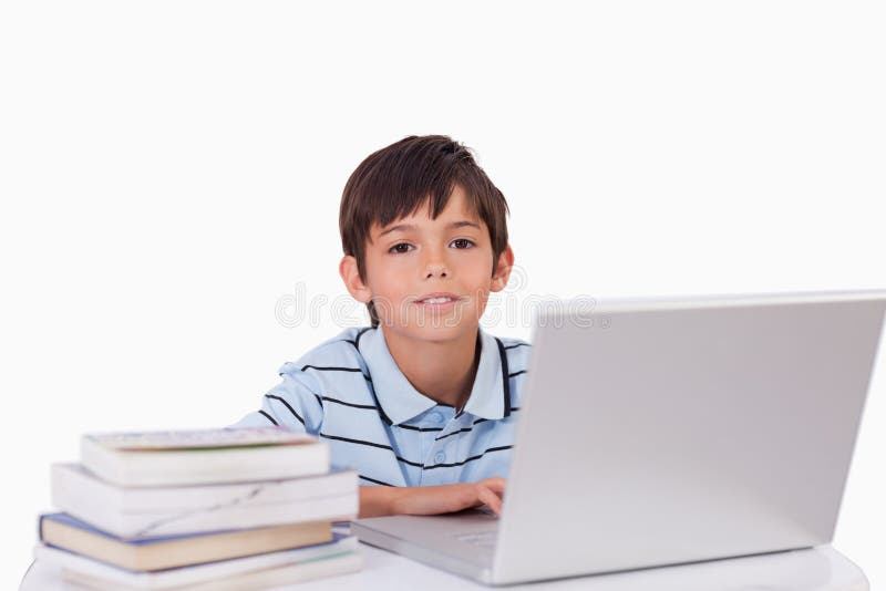 Boy working with a notebook stock photo