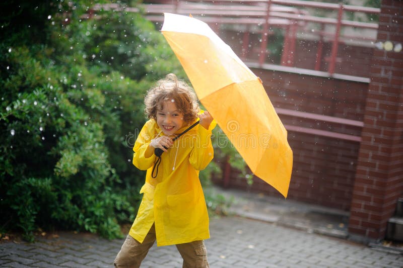 Boy of 8-9 years in the rain.