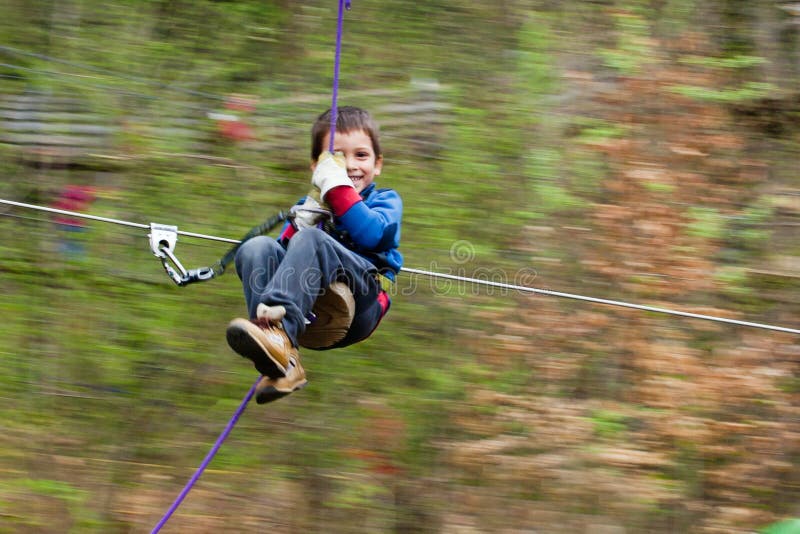 Boy on zip line royalty free stock image Boy on zip line royalty free stock image