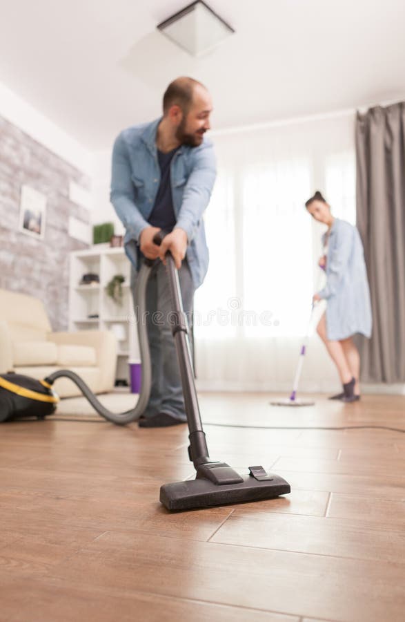 Boyfriend cleaning house stock image. Image of bedroom 191250761