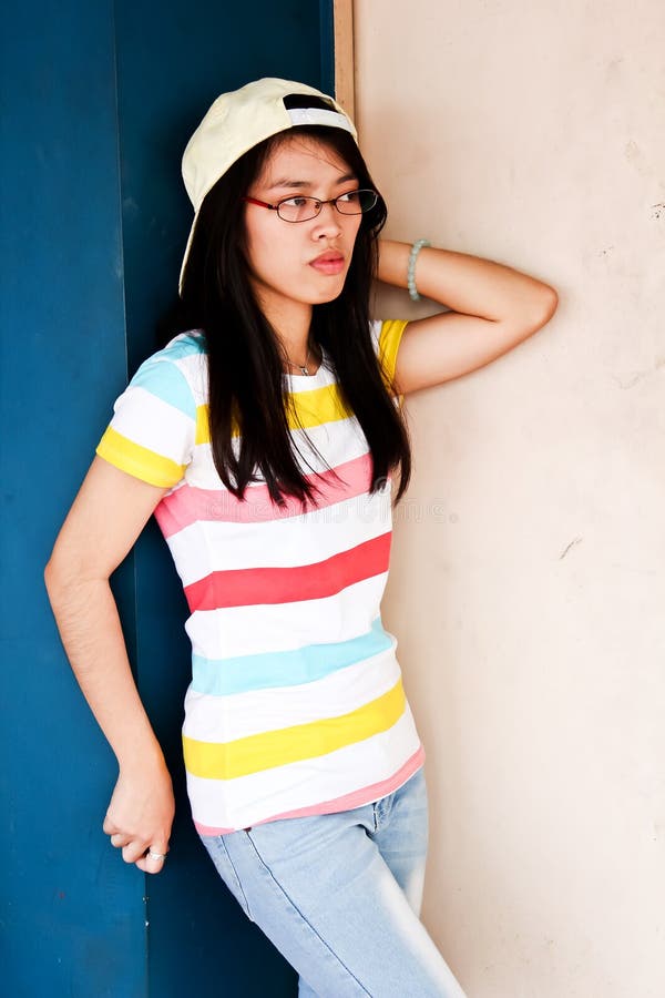 Boyish Pretty young Asian girl with glasses