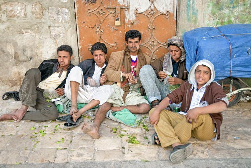 Boys chewing khat qat leaves in street sanaa yemen