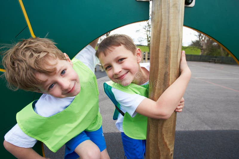 Boys on Climbing Wall in School Physical Education Class Stock Photo