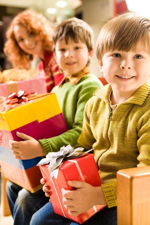 Boy and a Christmas Tree stock photo. Image of gifts, smiling 7066688