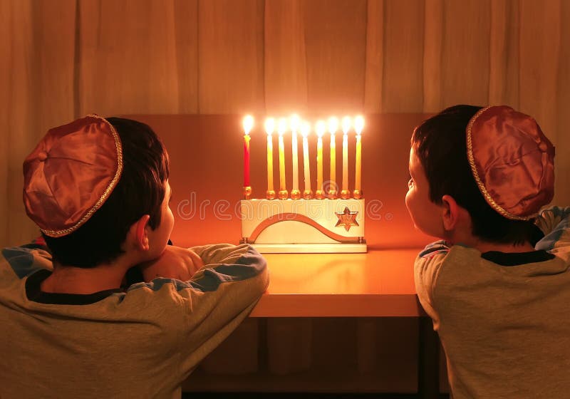 Boys Look at Hanukkah Menorah stock image Boys Look at Hanukkah Menorah stock image