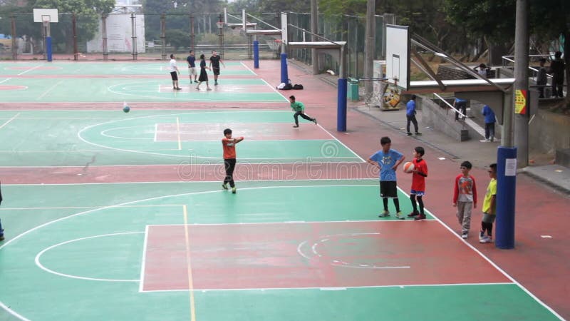 Boys Playing Basketball at the Tunghai University. HD