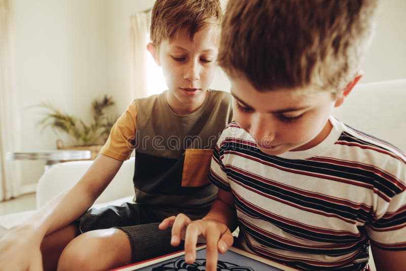 Kids using tablet pc for learning art royalty free stock images