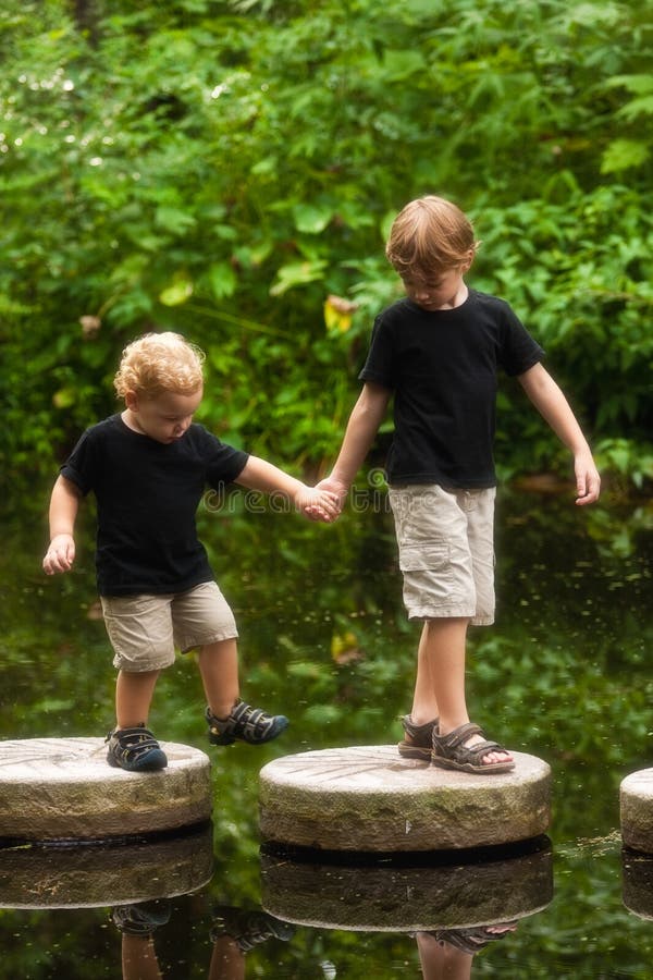 Boys on stepping stones