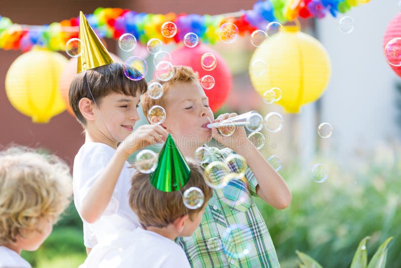 Boys wearing birthday hats stock photo. Image of small 88641696