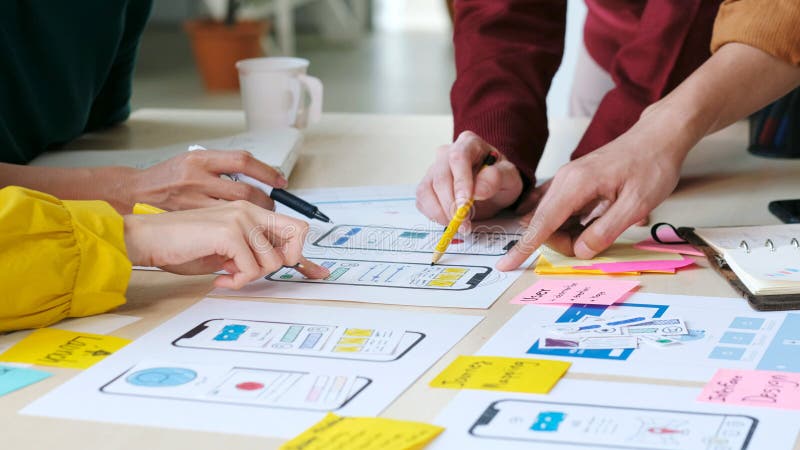 Brainstorm planing creative teamwork, Close up of hands mobile phone app developer team meeting about screen display prototype royalty free stock photography.