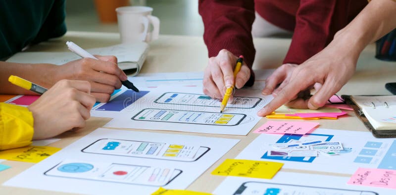 Brainstorm planing creative teamwork, Close up of hands mobile phone app developer team meeting about screen display prototype stock photo