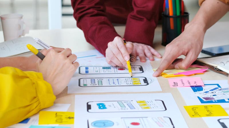 Brainstorm planing creative teamwork, Close up of hands mobile phone app developer team meeting about screen display prototype royalty free stock image.