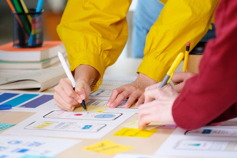 Brainstorm planing creative teamwork, Close up of hands mobile phone app developer team meeting about screen display prototype royalty free stock photography.