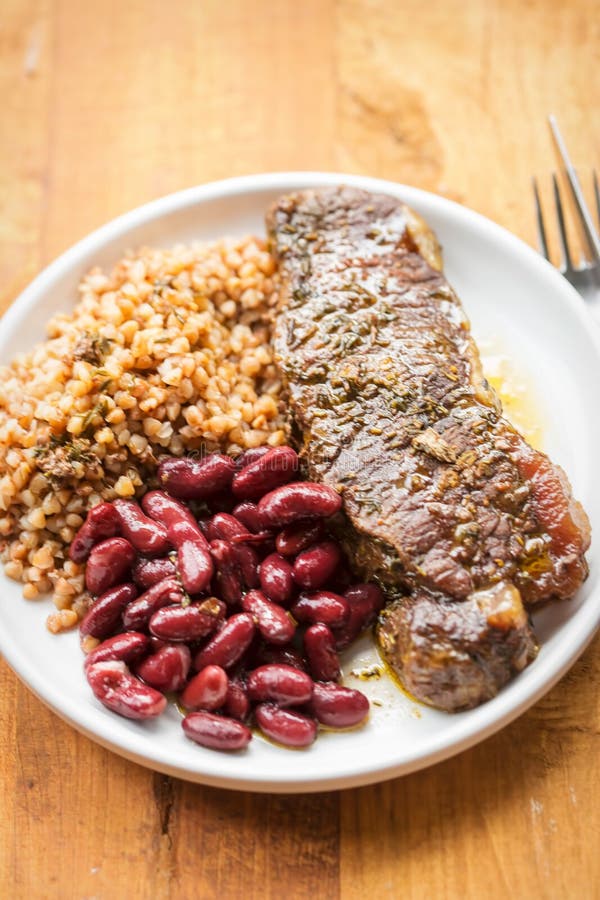 Braised Beef Steak in Red Wine with Beans & Barley Stock Photo Image